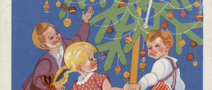 Pocztówka przedstawiajacą święta Bożego Narodzenia. Na poctówce trójka dzieci, rzymaja się za ręce i tańcza wokół zielonej, żywej choinki. Na chooince palą się świeczki i wiszą bombki. Pod obrazkiem napis 